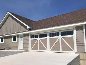 Garage door panel hail damage during Austin Texas spring storm season