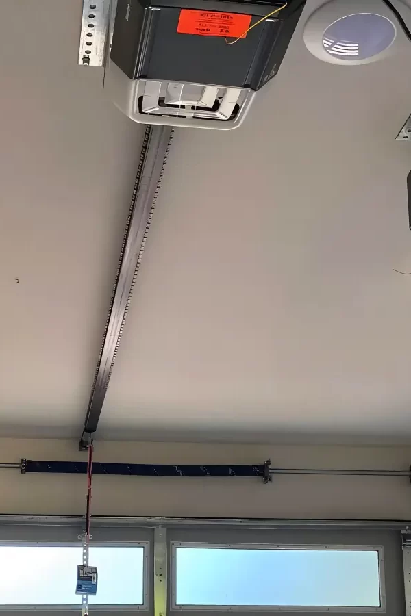 cleaning-garage-door-sensor-lens-austin-tx